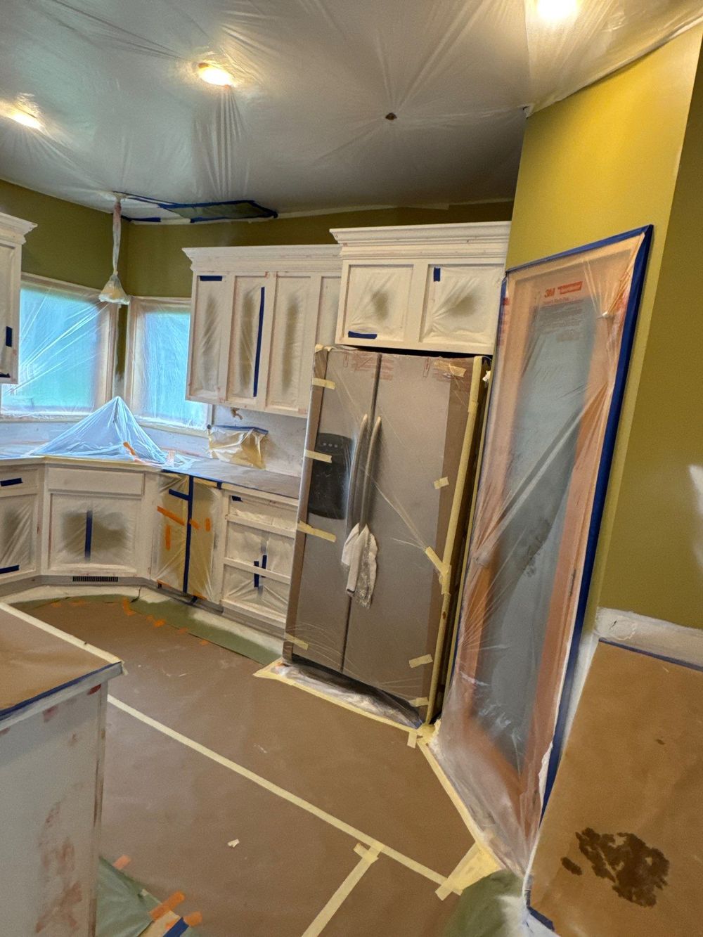 Kitchen carefully masked and protected before painting